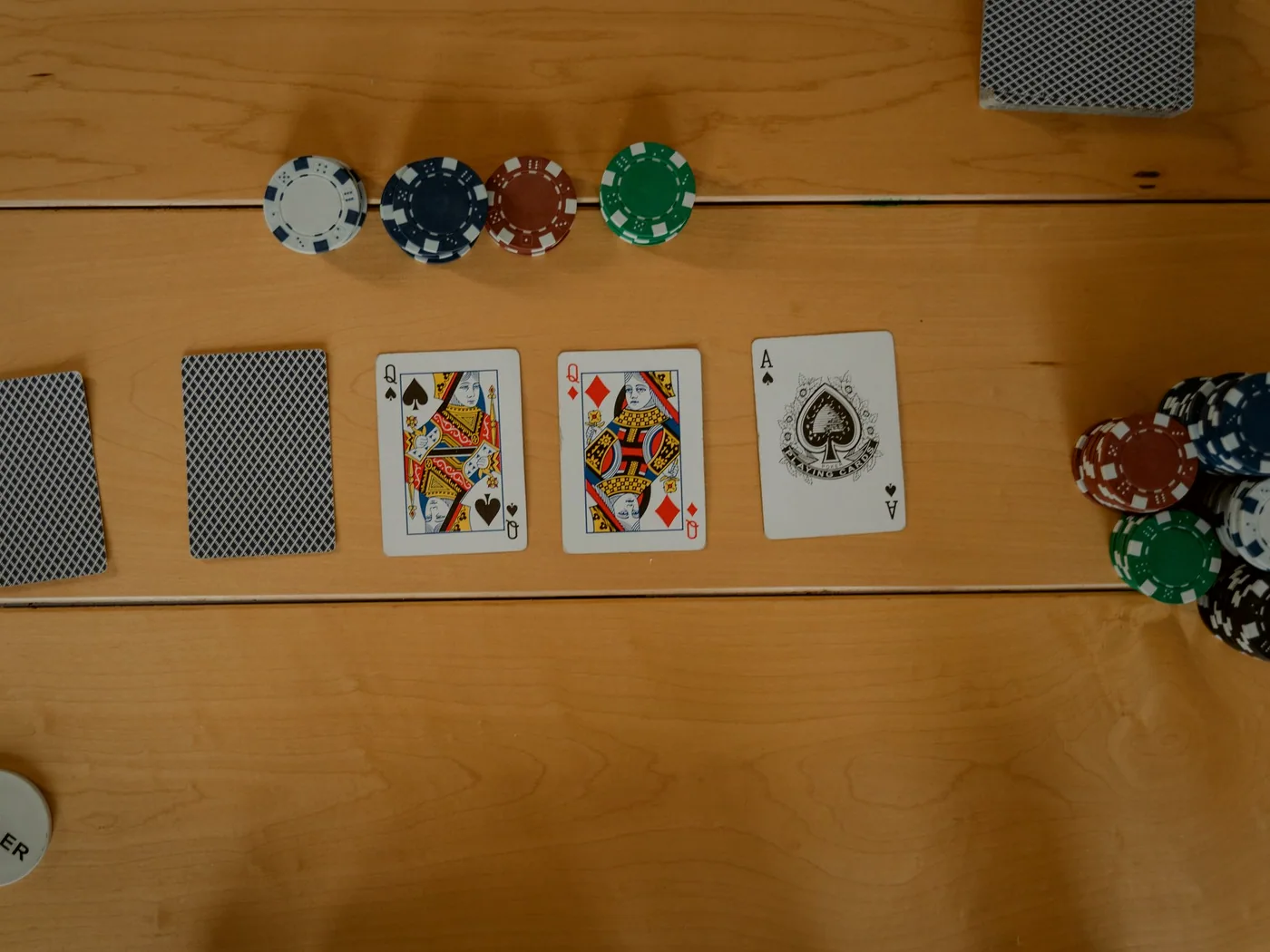 Hand of cards dealt across green felt